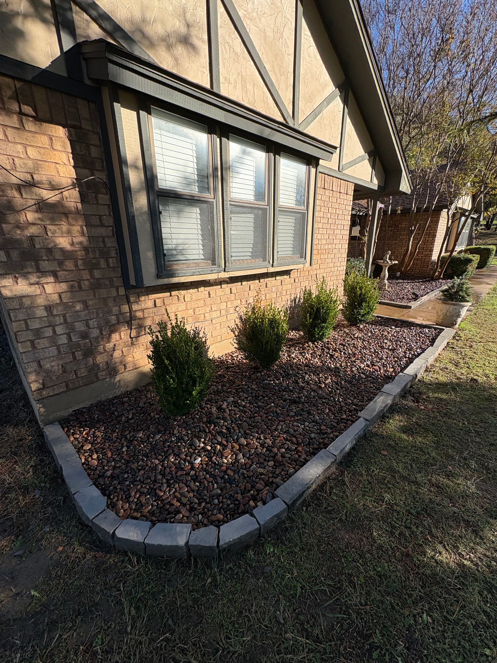 Gallery photos for Elegant Landscaping with Herringbone Porch and Rock Beds: Image #1